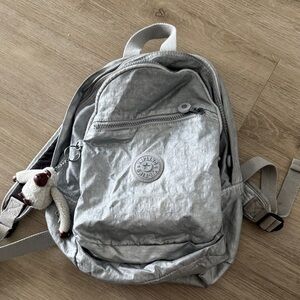 Kipling Metallic Silver Backpack with Monkey Charm